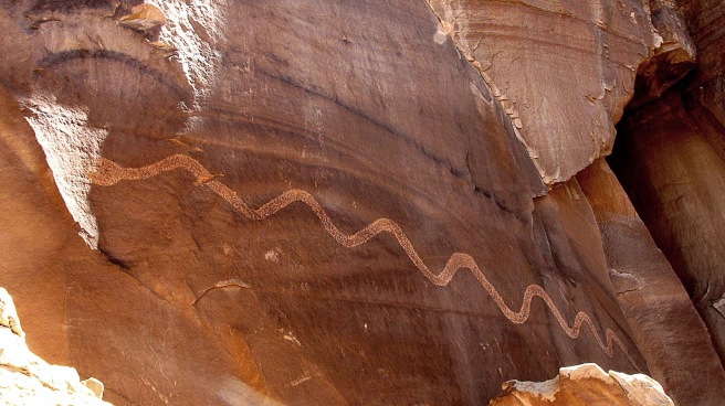 summer solstice snake near moab utah-17 ft long-pierced by light